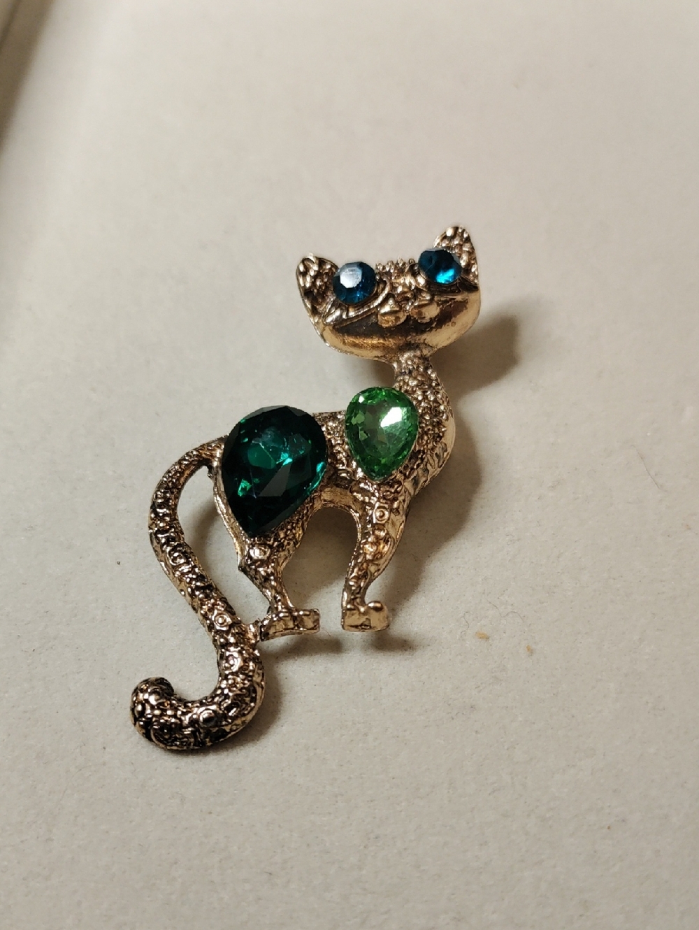 Gold Cat Brooch with Blue and Green Gem Accents